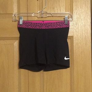 Black with pink band Nike Pros